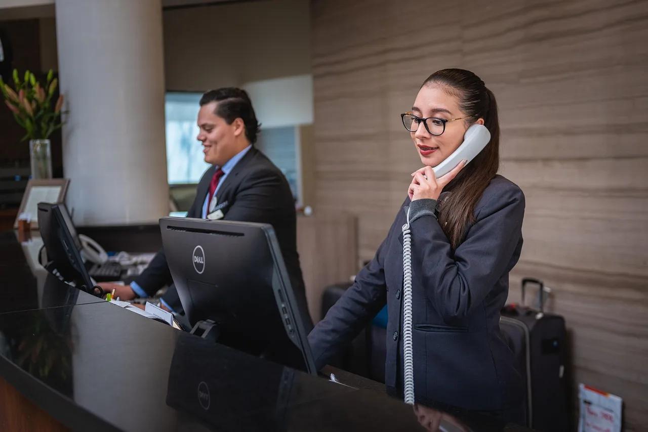 receptionists, phone call, hotel, reception, woman, man, work, attention, lobby, employees, professional, company, assistance, hotel, hotel, hotel, hotel, hotel, reception. Small Business Customer Retention Benchmarks: The Numbers and What Sits Behind Them