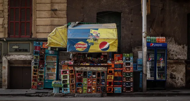 Vibrant street side mini market with colorful products and beverage promotions. Local Advertising for Small Business: 2027 Guide