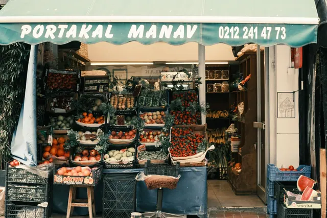 Colorful fruit and vegetable stall with canopy on a street market. Small Business Content Marketing: 2027 Guide