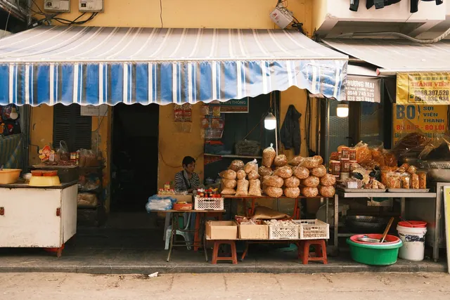 A vibrant street vendor setup in a bustling urban market, showcasing local goods. Small Business Market Research: 2027 Guide