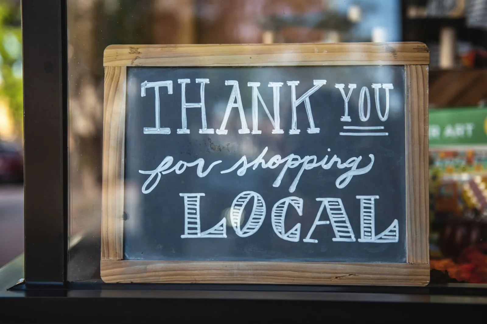 shallow focus photo of thank you for shopping signage Shop Local | Instagram: @timmossholder. What Separates the Strong Small Business Marketing Strategy Examples From the Weak